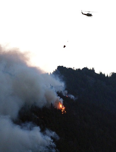 PHOTO BY JOE WESTON The Roaring Lion Fire has claimed 16 homes and consumed more than 8,200 acres of forest since July 31. It also generated a flurry of accusations relating to a controversial logging proposal in the area.